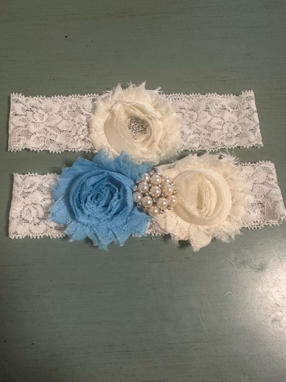 White Lace Garter Set with Ivory and Blue Flower Accents